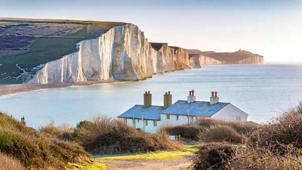 Coastguard cottages and Seven Sisters cliffs outside Eastbourne, East Sussex