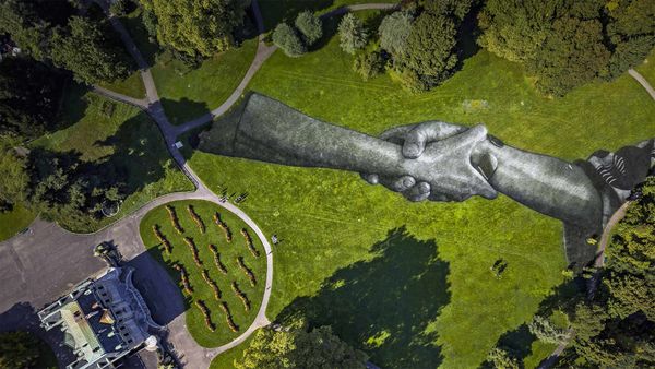Artist Saype\'s \'Beyond Walls\' installation in the Parc de la Grange, Geneva, Switzerland
