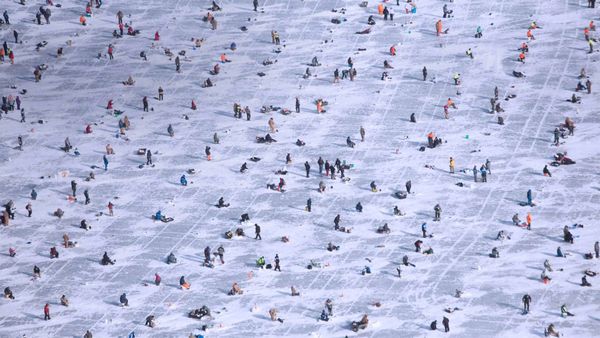 People ice fishing on Gull Lake in Brainerd, Minnesota, USA