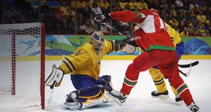 Goalkeeper Jonas Gustavsson of Sweden makes a save against Dmitri Meleshko of Belarus during the Men’s Ice Hockey preliminary game at the Vancouver 2010 Winter Olympics on February 19, 2010 -- Bruce Bennett/Getty Images &copy; (Bing Canada)
