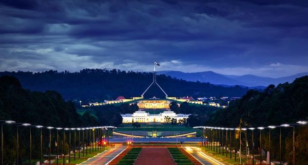 View from the Australian War Memorial down Anzac Parade toward the New and Old Parliament Houses in Canberra, Australia