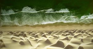 Waves of water meet waves of sand on the beach of the Pacific ocean near Paracas, Peru -- George Steinmetz/Corbis &copy; (Bing Australia)