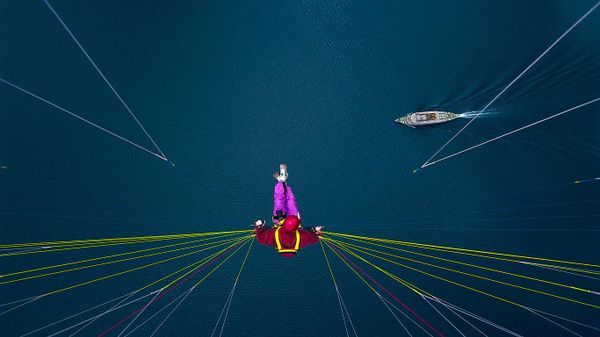 Paraglider over Lake Thun, Switzerland