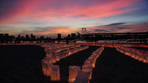 Candles line the beach at Odaiba Marine Park for Marine Day, Tokyo, Japan (© Keystone USA-ZUMA/Rex Features)(Bing Australia)