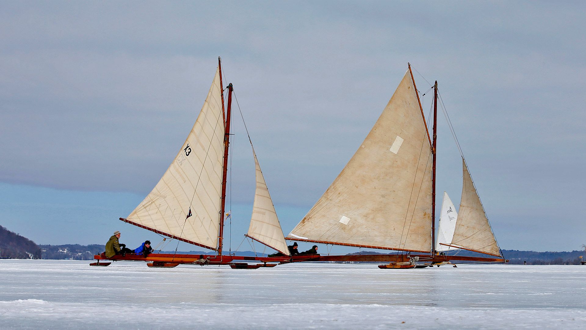 Antique iceboats on the frozen Hudson River near Astor Point in Barrytown, New York