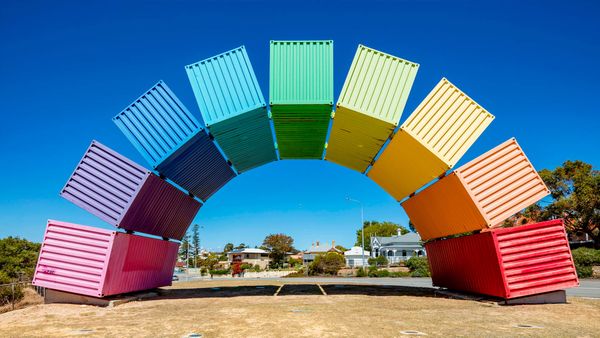 Wide angle view of rainbow-coloured shipping containers in Fremantle, Australia