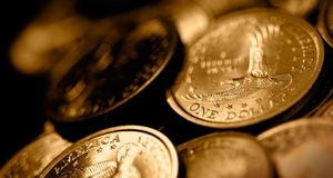 U.S. dollar coins (© Guy Cali/FogStock/Aurora Photos) &copy; (Bing United States)