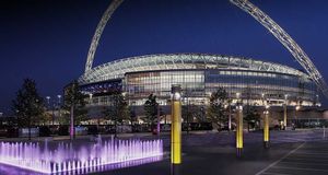 Wembley stadium, London, United Kingdom, night shot with purple fountain in foreground, HOK sport | Foster /Photolibrary &copy; (Bing United Kingdom)