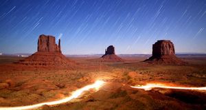 Still image of time-lapsed night sky and lights in Monument Valley Navajo Tribal Park, Utah (© Duncan Frazier/Getty Images) &copy; (Bing United States)