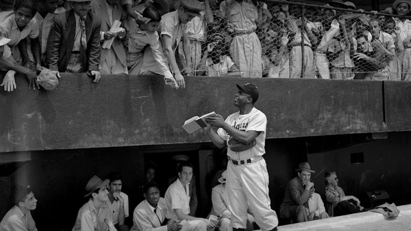 Jackie Robinson signs autographs at spring training in Ciudad Trujillo, now Santo Domingo, Dominican Republic, on March 6, 1948