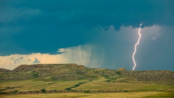 Lightning striking over 70 Mile Butte and Sleeping Lion Butte, Grasslands National Park, Saskatchewan