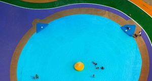 Colorful children's paddling pool in Watford, Hertfordshire, England (© Jason Hawkes/Corbis) &copy; (Bing Australia)
