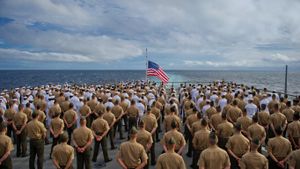 Marines and sailors aboard the USS Pearl Harbor dock landing ship during the 2011 ceremony commemorating the 70th anniversary of the attack on Pearl Harbor (© Super Nova Images/Alamy)(Bing United States)