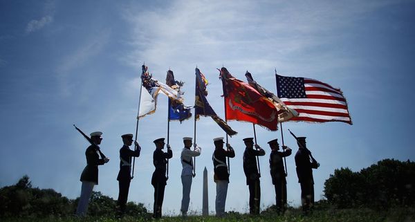 A U.S. military color guard  at the Vietnam Veterans Memorial in Washington, DC
