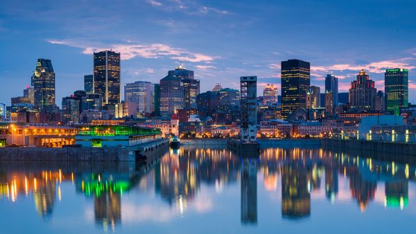 Montreal skyline reflecting in St. Lawrence River, Quebec