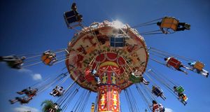 Kids enjoying an amusement park ride on Eid in the West Bank city of Tulkarm -- Zhao Yue/Corbis &copy; (Bing New Zealand)