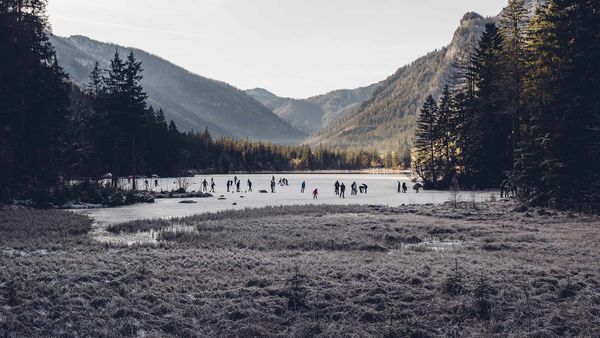 Ice skaters on Hintersee, a lake in Ramsau, Berchtesgadener Land, Bavaria, Germany