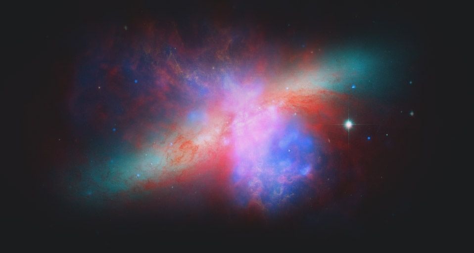 NASA's Spitzer, Hubble, and Chandra space observatories teamed up to create this view of the M82 galaxy