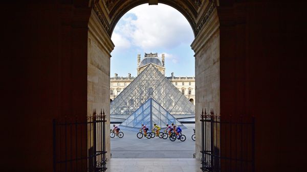 Tour de France riders in front of the Louvre Pyramid and museum in Paris, France, during the 2020 race