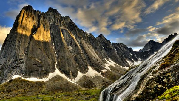 Flowing glacial creek with Mount Harrison Smith in background, Cirque of Unclimbables, Nahanni National Park, Northwest Territories