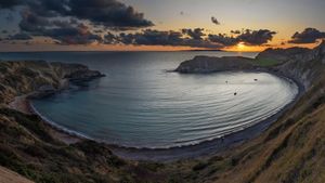 Panoramic view of Lulworth Cove at sunset in Dorset, England (© Adrian Baker/Shutterstock)(Bing New Zealand)