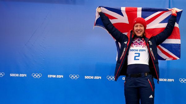 Gold medalist Lizzy Yarnold of Great Britain celebrates on the podium during the flower ceremony for the Women's Skelton on Day 7 of the Sochi 2014 Winter Olympics at Sliding Center Sanki on February 14, 2014 in Sochi, Russia