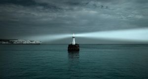 Lighthouse shining on White Cliffs of Dover and the English Channel (© Grant Symon/Getty Images) &copy; (Bing United Kingdom)