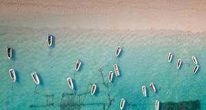 Aerial view of rowboats near Bali, Indonesia (© Sean White/plainpictures) &copy; (Bing Australia)