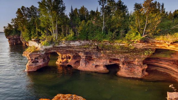 Layered sandstone cliffs and sea caves on Devils Island in the Apostle Islands National Lakeshore, Wisconsin