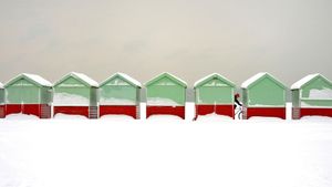 Beach huts covered in snow in Brighton and Hove, England (© Tim Jones/Alamy)(Bing United States)