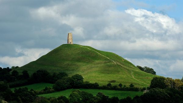 Glastonbury Tor and St Michael\'s Tower for the start of the Glastonbury Festival