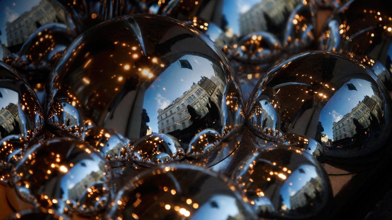 Luxury stores reflected in the Christmas window display of the Fenwick's, London
