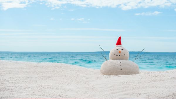 Australian Christmas sandman on a white sand
