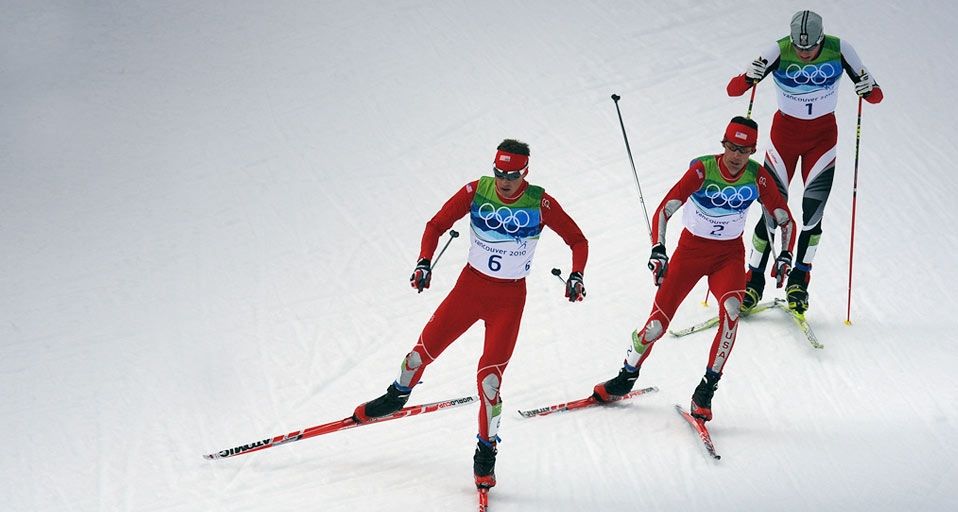 Gold medalist Bill Demong (L) and  silver medalist Johnny Spillane (C) of the United States and Austria's bronze medalist Bernhard Gruberin compete in the Men's Nordic Combined Cross Country at the Vancouver Winter Olympics on February 25, 2010