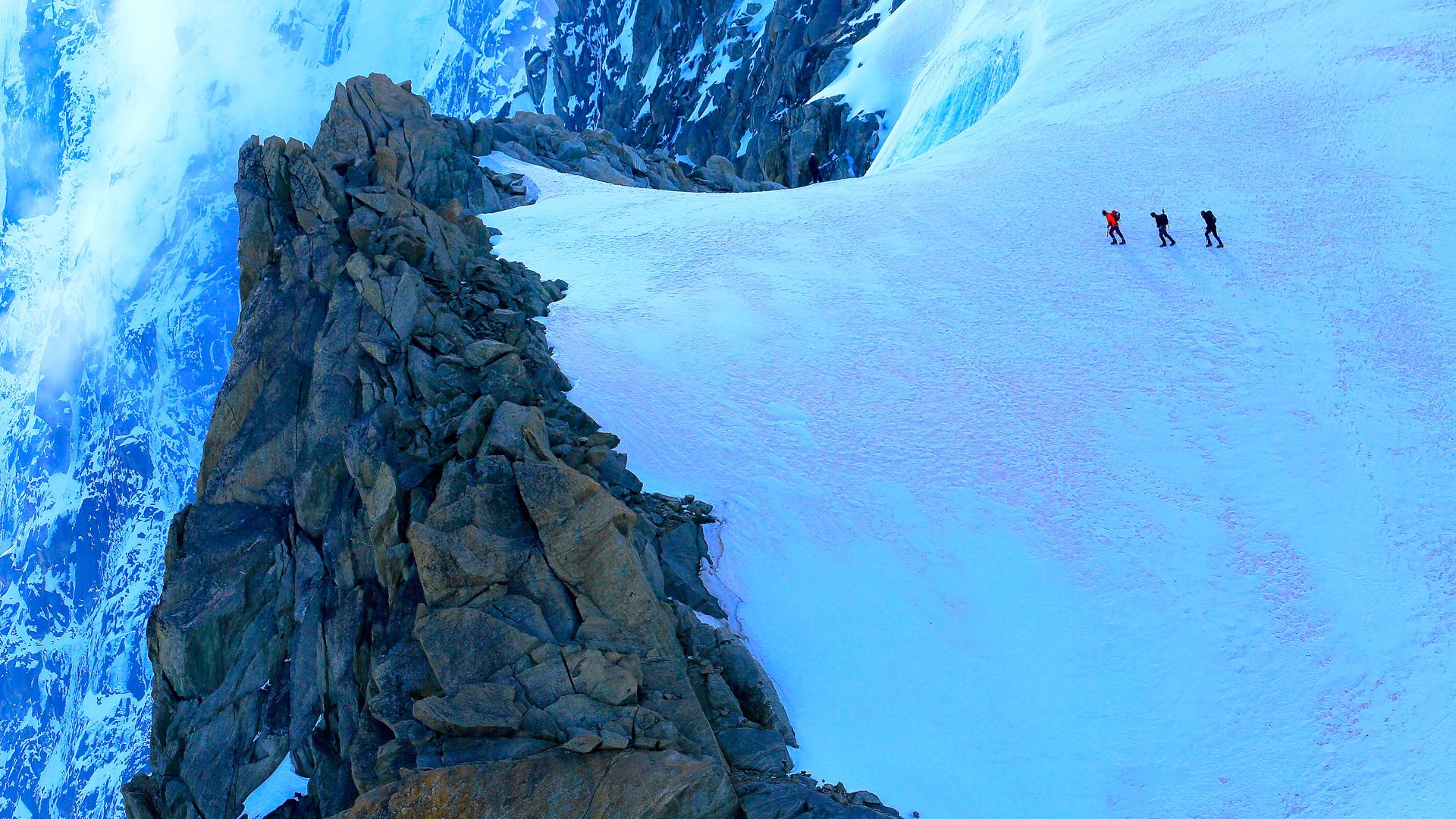 Hikers on alpine glacier, Mont Blanc, Chamonix, France