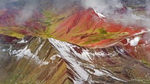Aerial view of snowy peaks of Vinicunca (aka Rainbow Mountain), Peru (© Jude Newkirk/Amazing Aerial Agency)(Bing United States)