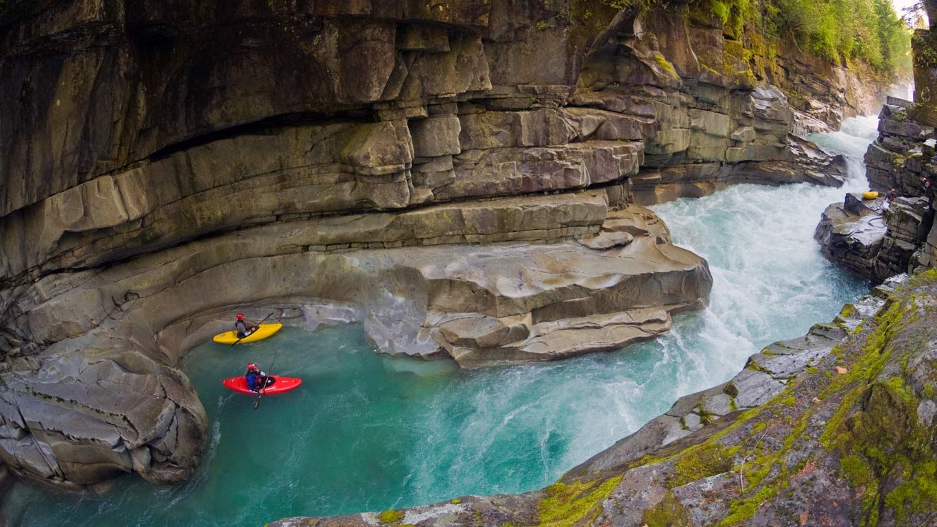 Kayakers in Ashlu Creek near Squamish, British Columbia, Canada