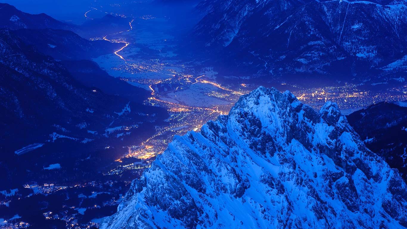 View over Waxenstein crest on illuminated town of Garmisch, Bavaria, Germany