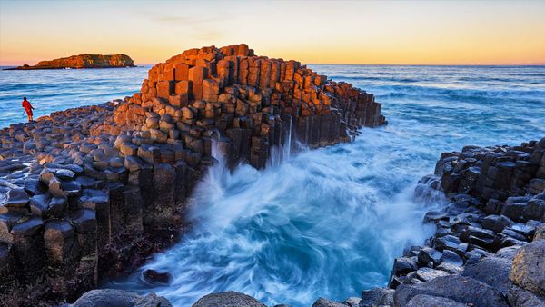 Fingal Head with a rock fisherman on the headland