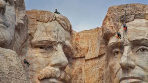 Park service employees inspecting Mount Rushmore National Memorial, South Dakota (© Universal Images Group via Getty Images)(Bing United States)