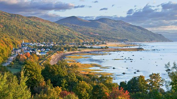 Village nestled between mountains and the St. Lawrence River, Charlevoix, Que.