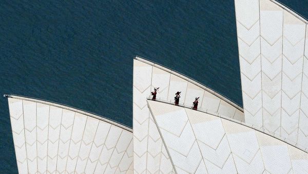 Royal Highland Fusiliers playing the bagpipes on top of the Sydney Opera House