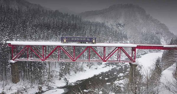 Akita Railway traveling over an iron bridge, Tohoku, Japan