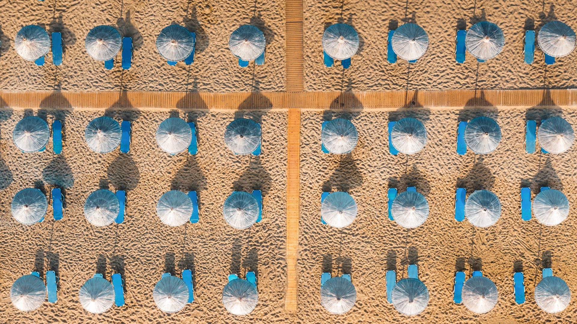 Blue sunbeds on a sandy beach in Vai, Crete, Greece