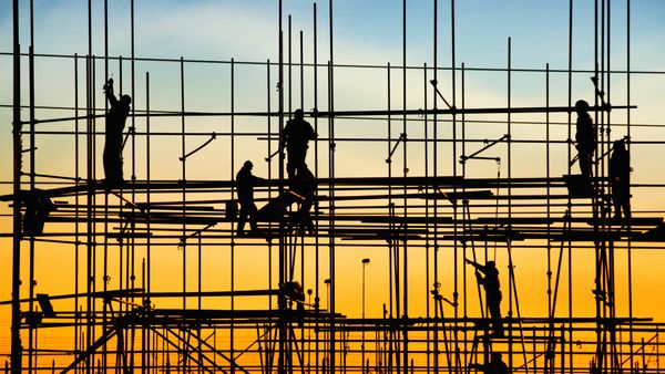 Construction workers on scaffolding