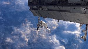 NASA astronaut works on the International Space Station during a spacewalk in 2006 (© NASA)(Bing United States)