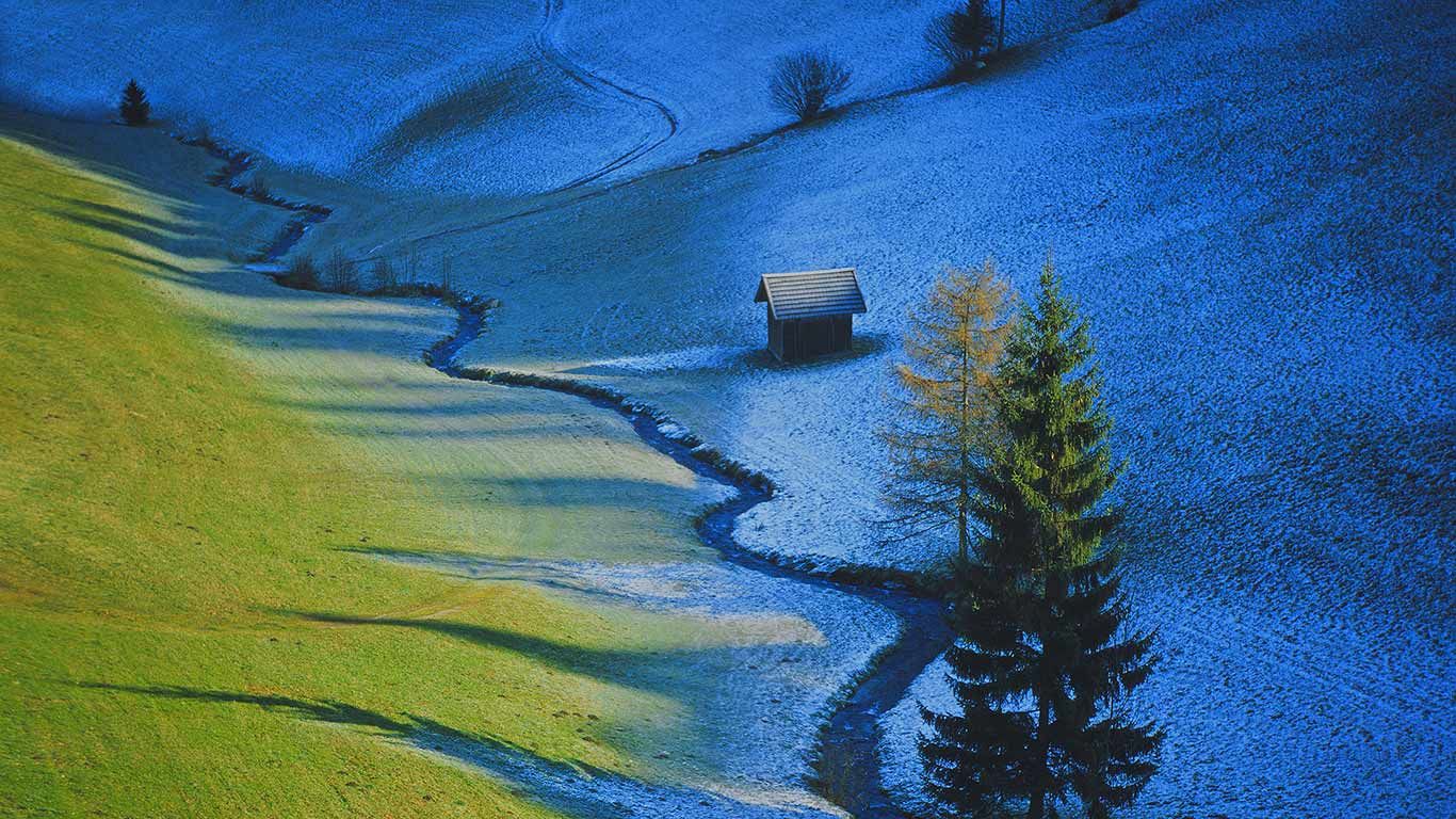 Sun defrosts half a meadow in Tulfes, Austria