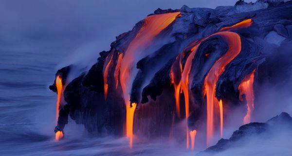 Viscous lava from Kilauea continues to pour into the ocean at Kalapana, Hawaii, USA