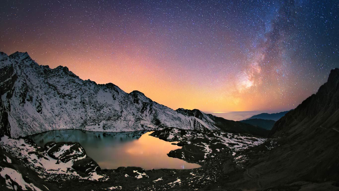 Nepal's Gosaikunda Lake in the Himalayas and the Milky Way above