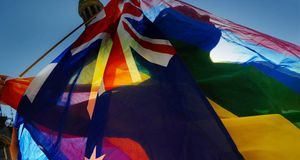 A protester shows his colours during a gay rights march through Sydney --Torsten Blackwood/Getty Images &copy; (Bing Australia)